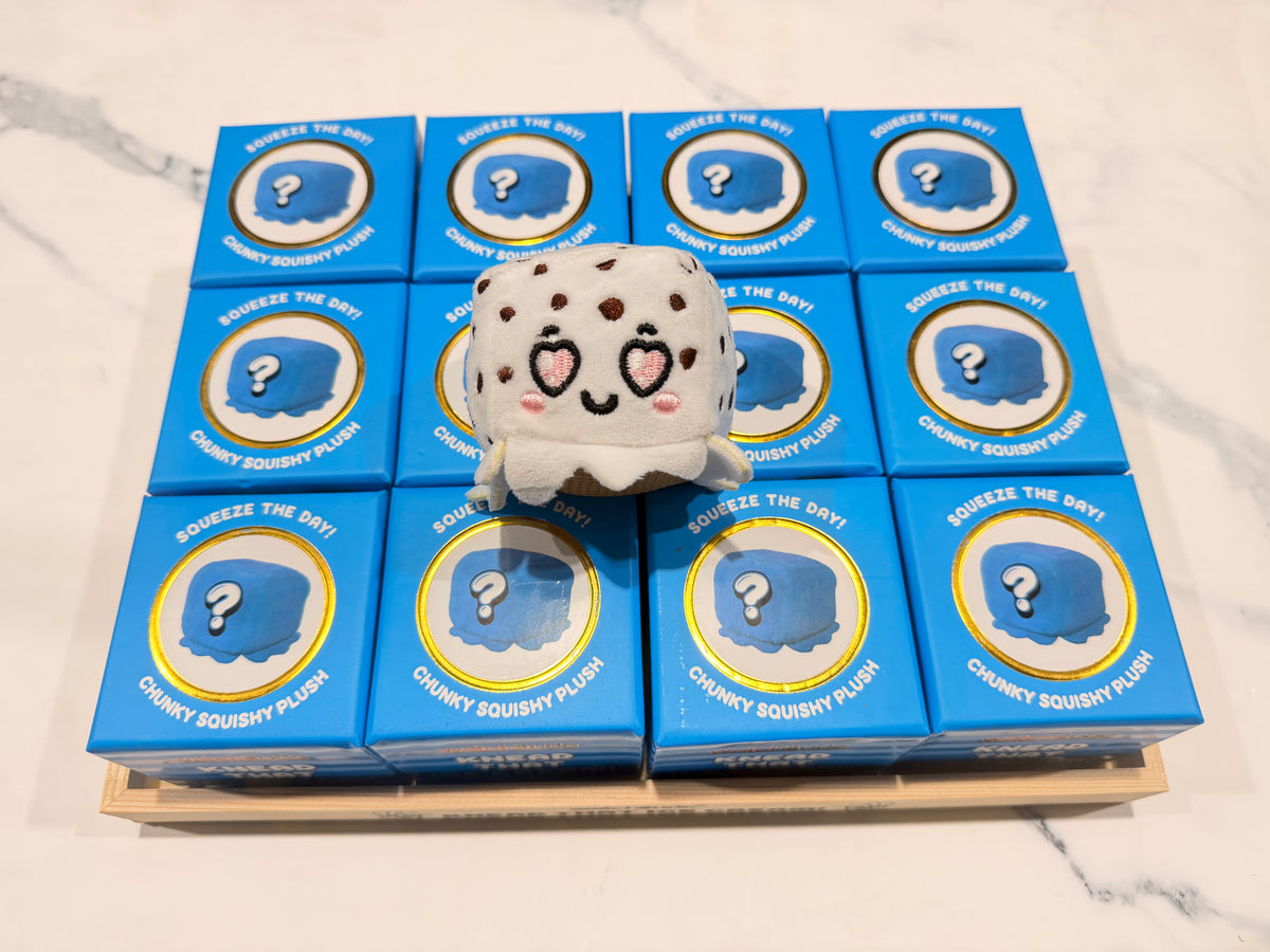 Knead That Ice Cream 12-pack blind box display with a cookies and cream squishy plush on top